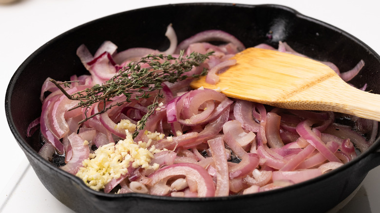 Cooking onions, thyme and garlic