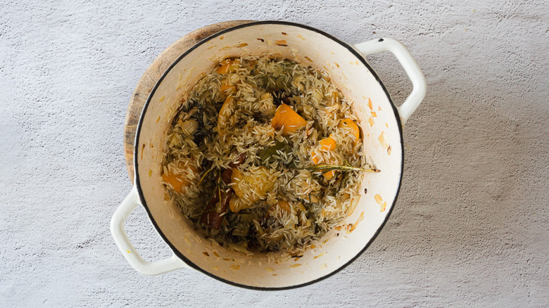 Rice and aromatics in pot