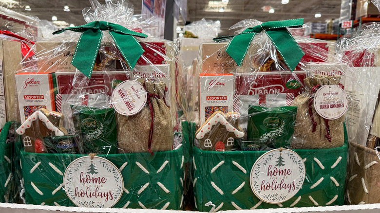 Green woven gift baskets filled with gourmet packaged foods