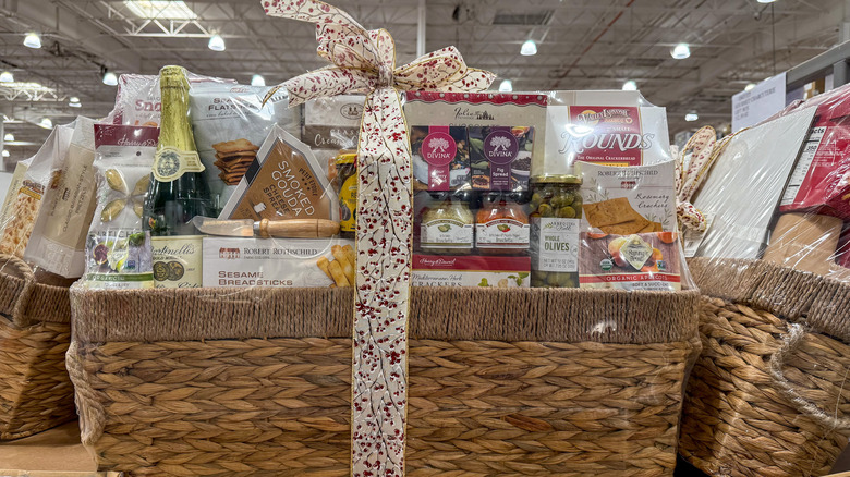 Large woven gift basket filled with packaged gourmet foods