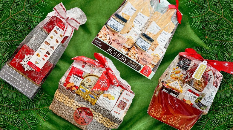 Four food gift baskets on green background