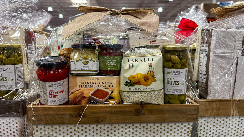 Polka-dot basket filled with jars and packages of gourmet foods