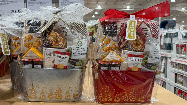 Two metal gift baskets on a shelf