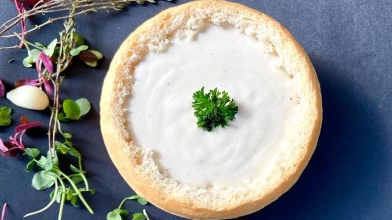 Creamy mushroom soup in bread bowl