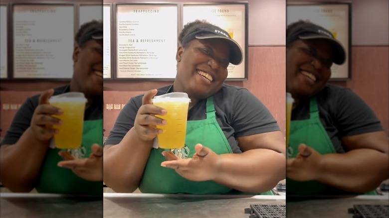 Barista holding a honey apple lemonade