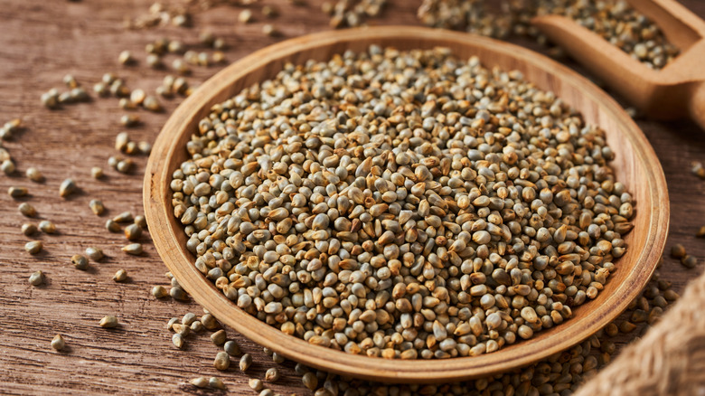 Bowl of pearl millet on wooden table