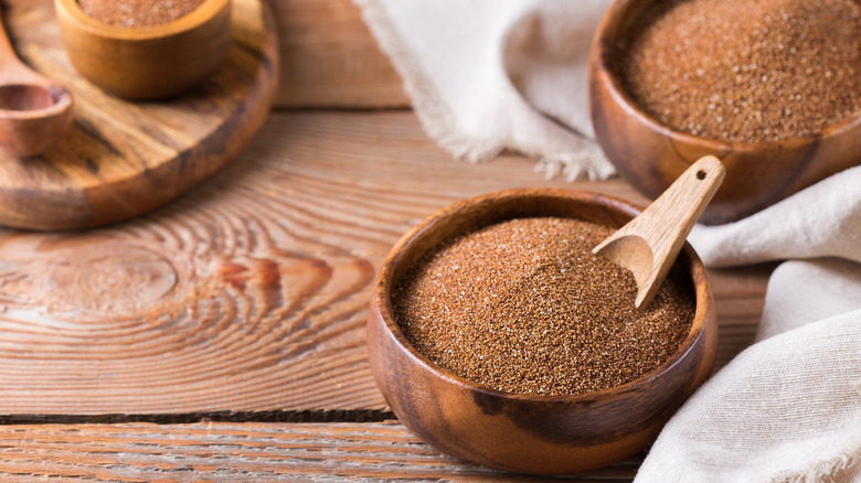 Bowl of African teff on wooden table