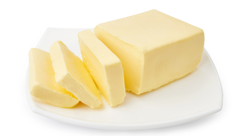 Sliced butter on plate