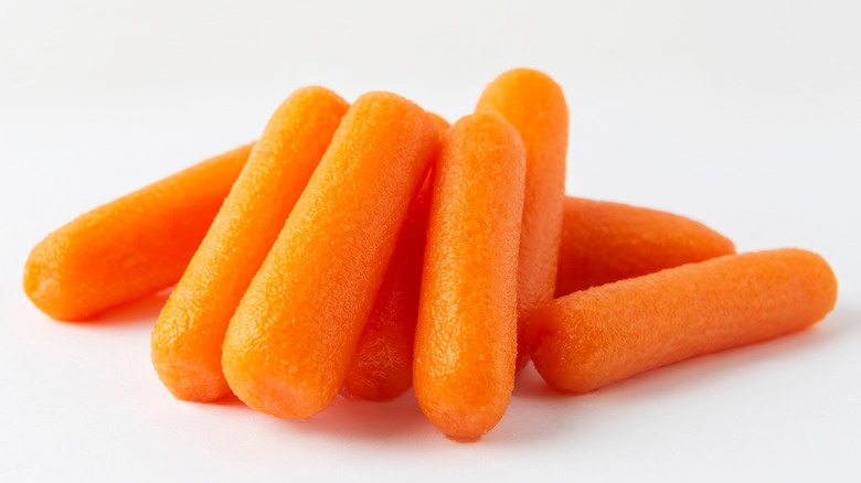 Baby carrots on white background