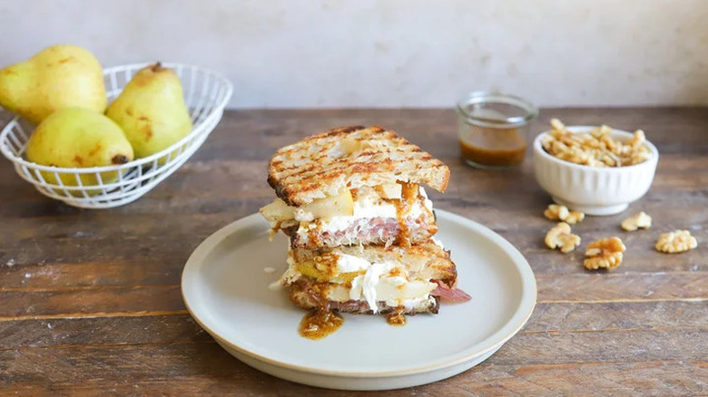 Walnut pear and prosciutto panini