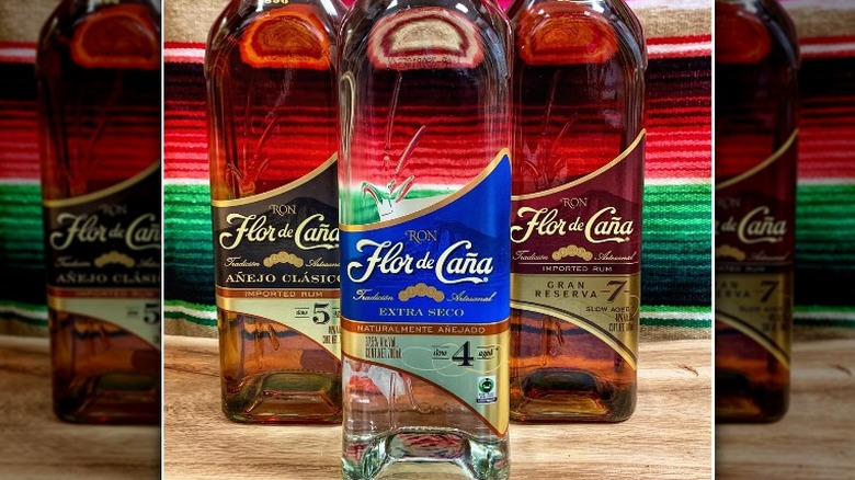 a bottle of Flor de Cana with carbon neutral and fair trade certifications