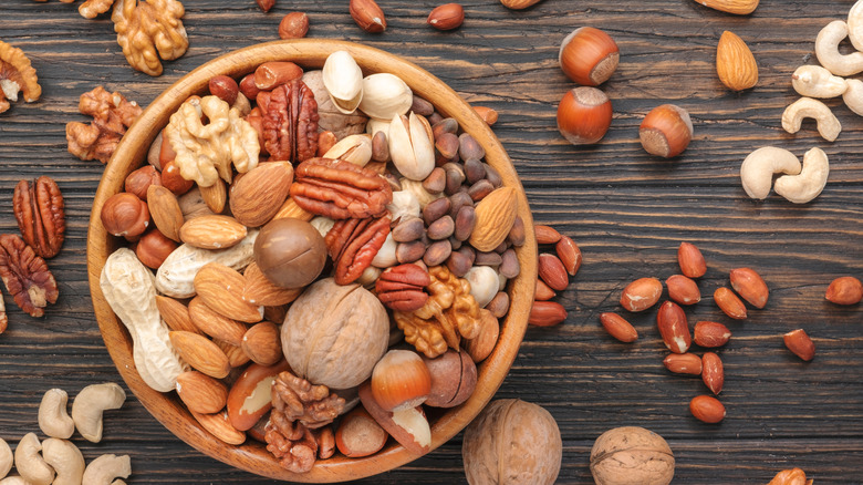 assortment of nuts in a wooden bowl
