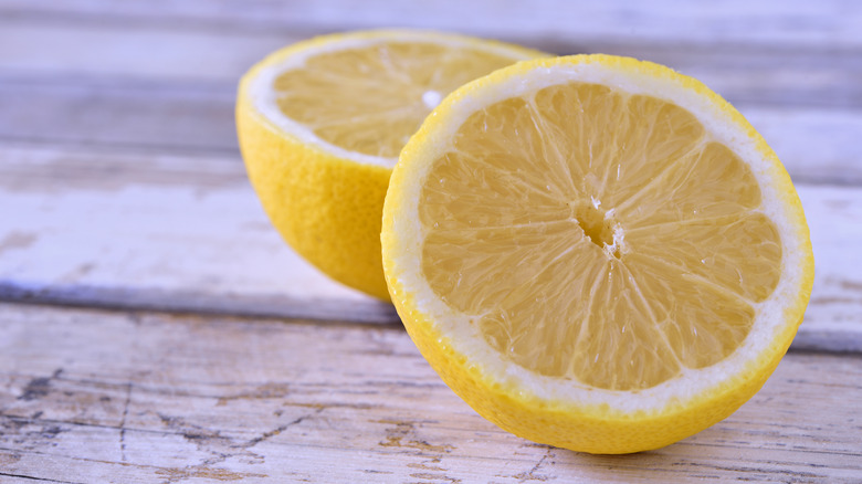 Sliced lemon on cutting board