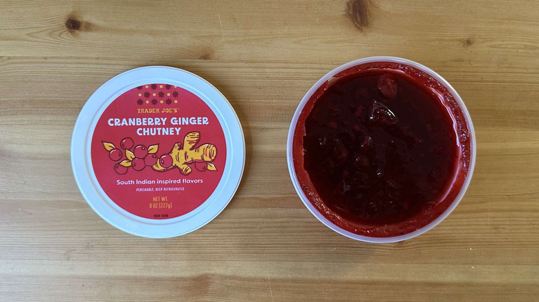 Tub of rich red Cranberry ginger chutney