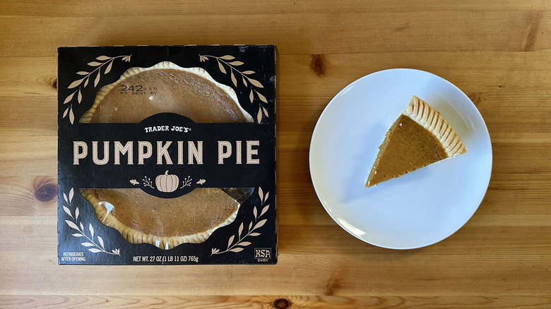 Trader Joe's pumpkin pie box, with a slice of pie on a plate