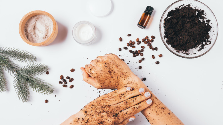 Person applying coffee scrub