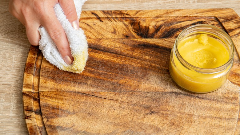 beeswax on wooden cutting board