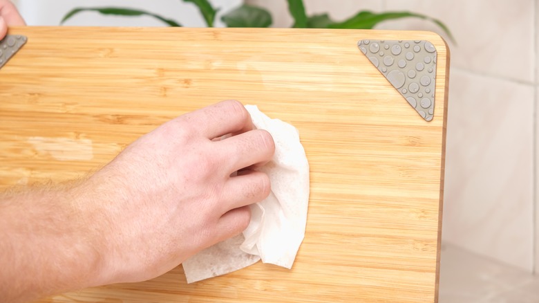 Hand scrubbing board with towel