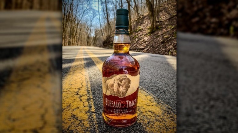 Bourbon bottle on road