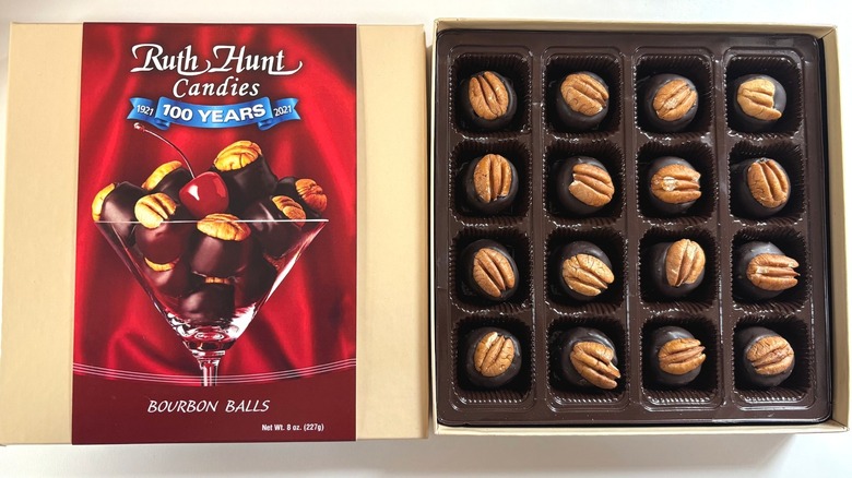 Box of Ruth Hunt bourbon balls next to lid on white table