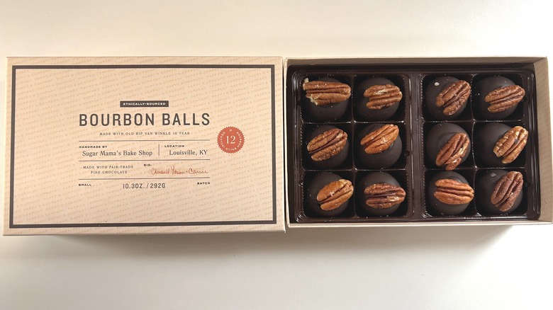 Box of Pappy & Company bourbon balls next to lid on white table