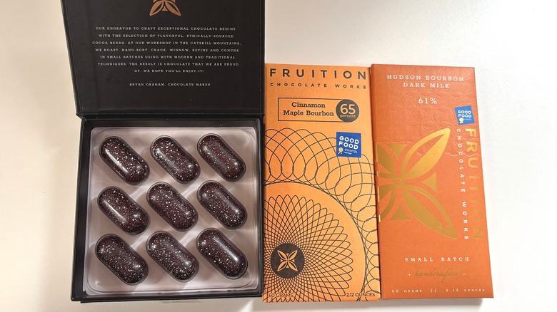 Fruition brown butter bourbon caramels and two bourbon chocolate bars on white table