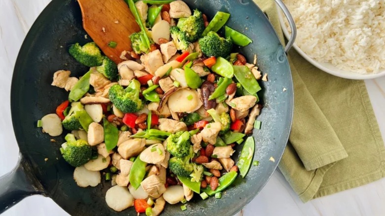 chicken and green vegetables in wok