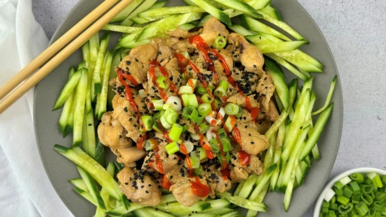 chicken and cucumber sticks with hot sauce