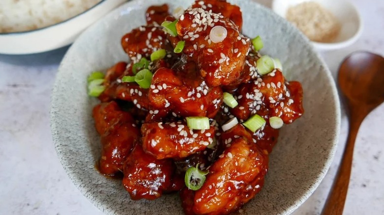 chicken pieces coated in red sticky sauce