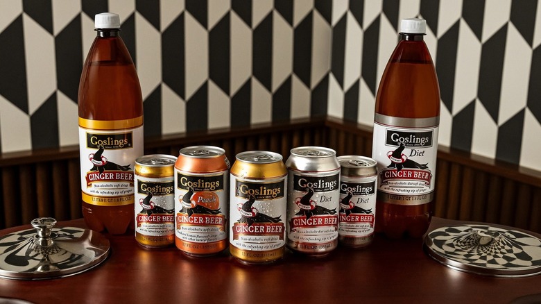 Goslings Ginger Beer cans and bottles on wooden table