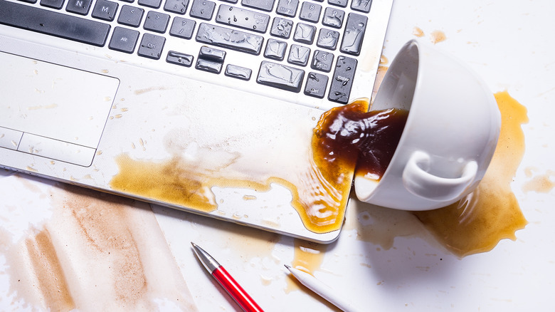 spilling coffee onto a computer