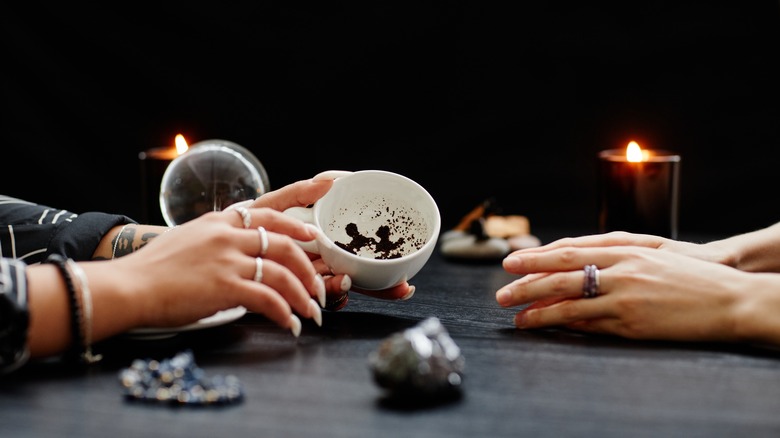 fortune teller reading coffee grounds 