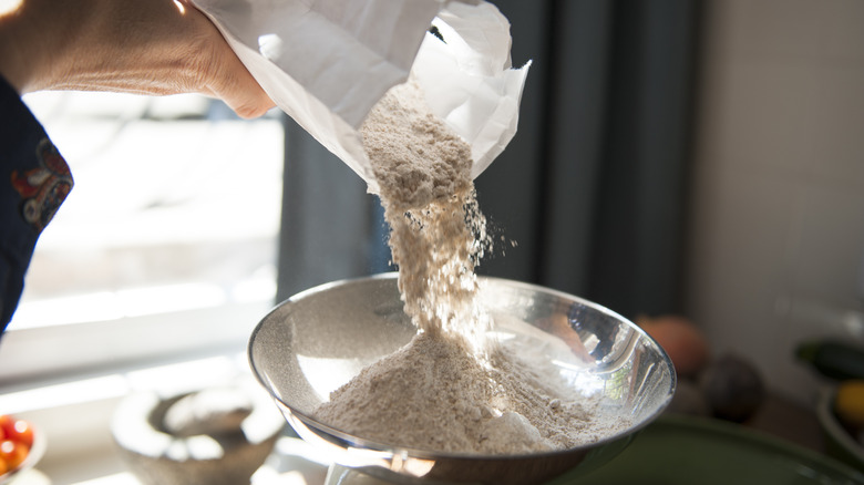 Person measuring flour