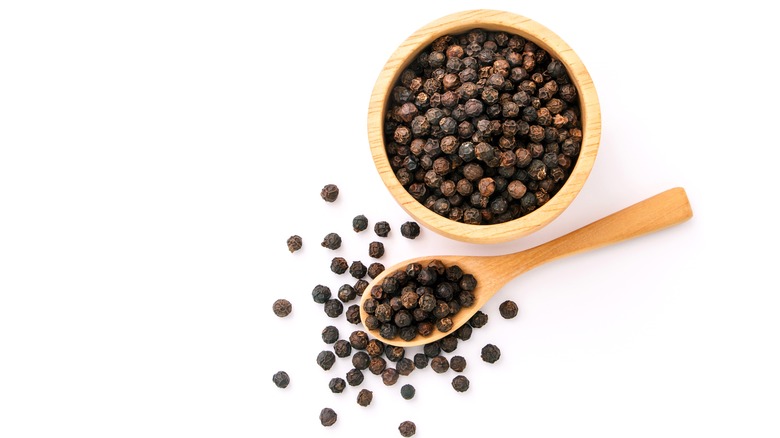 Bowl of black peppercorns