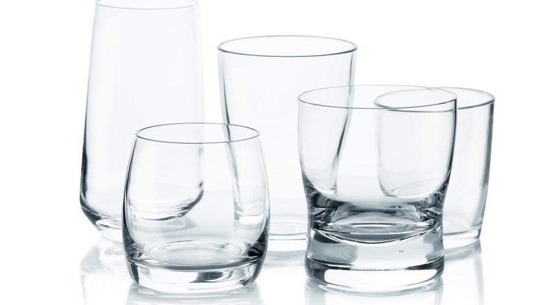 various glasses on white background