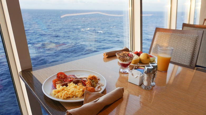 Two plates of food on a table at cruise ship buffet