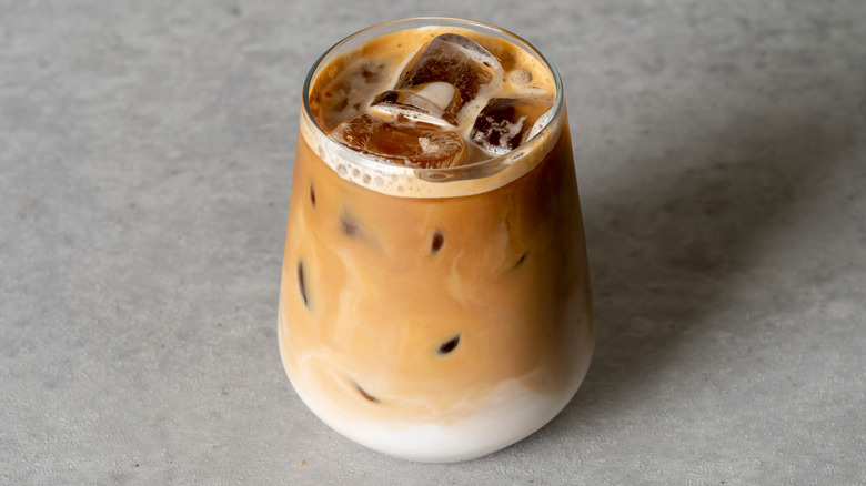 Iced latte in a glass cup