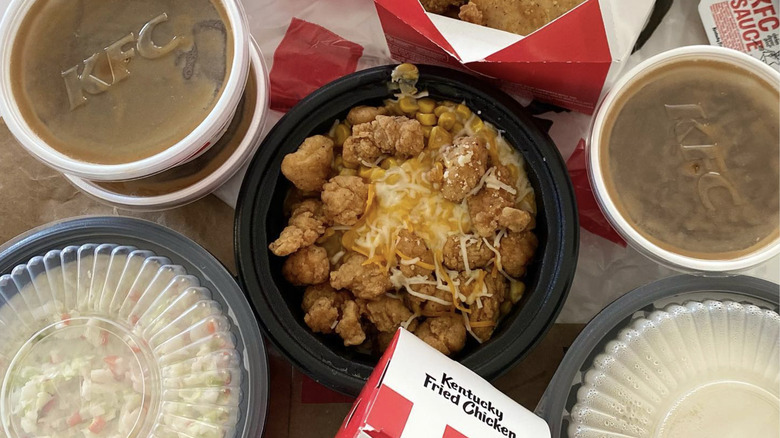 KFC Famous Bowl with sides of mashed potatoes, gravy, and coleslaw