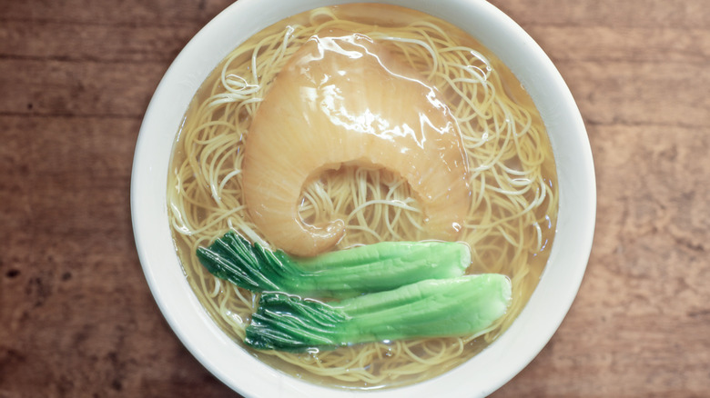 Bowl of shark fin soup and noodles