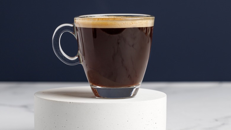 Espresso on white pedestal 