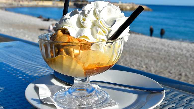 Bowl of ice cream with whipped cream on top 