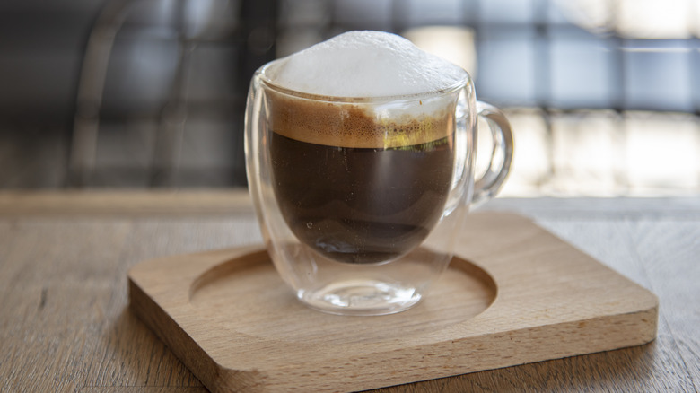 Macchiato on wooden board 