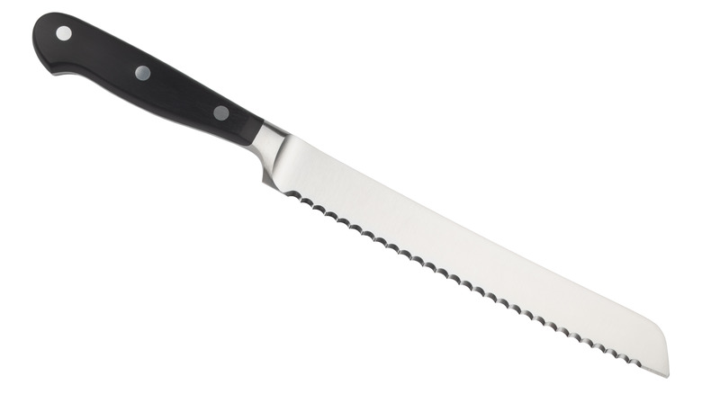 Serrated knife on white background