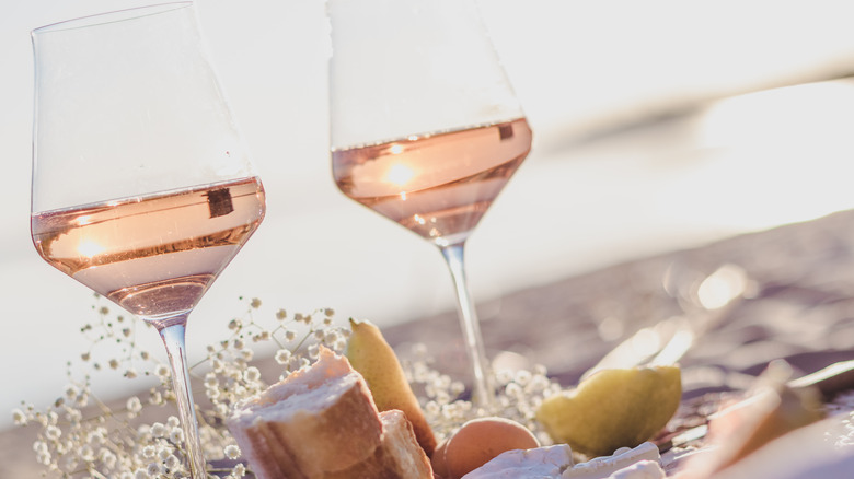 glasses of rose wine on the beach