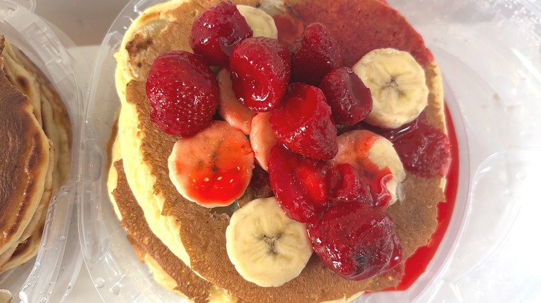 IHOP Strawberry Banana Pancakes stack on white table