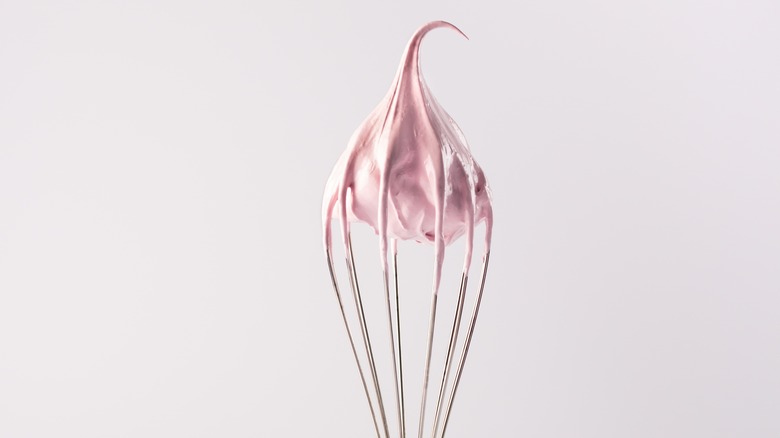 Whisk with pink cream