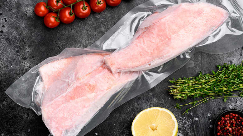 Frozen fish packages with herbs