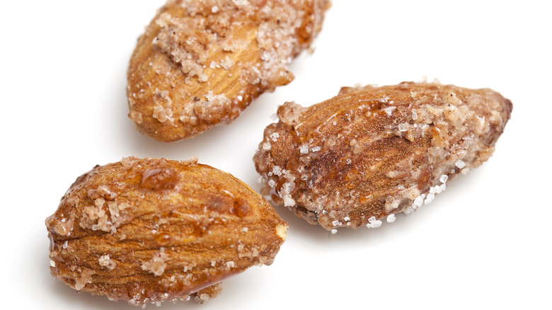 Candied almonds on white background