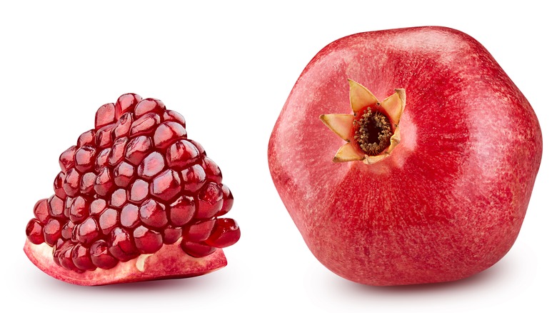 Whole and sliced pomegranate