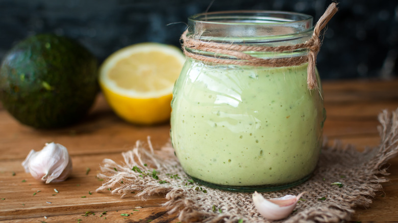 Glass jar of avocado salad dressing